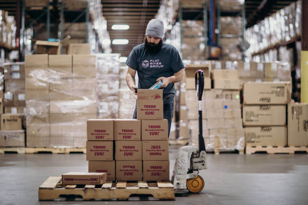 An FRG employee packages up boxes of toys for dropshipping.